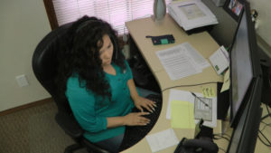 Raquel Ostos in the Datatech Support Department working to serve clients